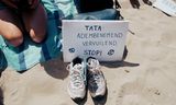 Protestbordje bij een <strong>demonstratie van Greenpeace tegen Tata Steel</strong>. 